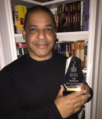 J.M. Erickson With Award